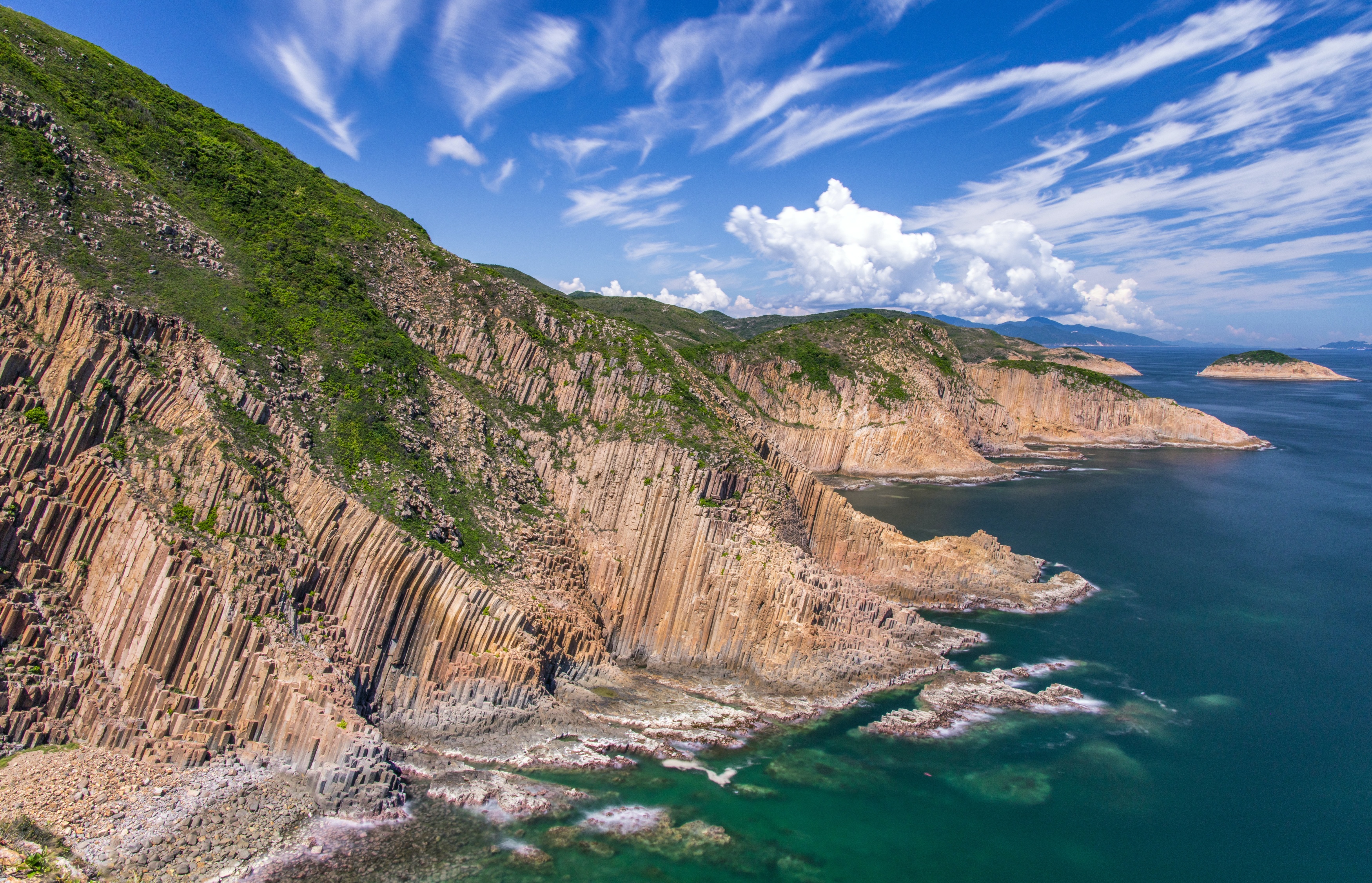 The Agriculture, Fisheries and Conservation Department announced today (October 22) that the Early Cretaceous rhyolitic columnar rock formation located in Hong Kong UNESCO Global Geopark had been selected as one of the First 100 International Union of Geological Sciences Geological Heritage Sites. Photo shows the Early Cretaceous rhyolitic columnar rock formation visible on High Island.
